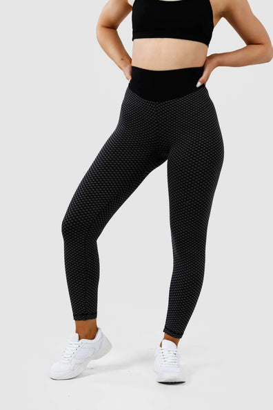 Girl wearing black luna scrunch bum leggings hands on hips